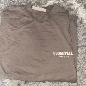 Fear of God Essentials Men’s Tshirt..size Small fits over sized a taupe color